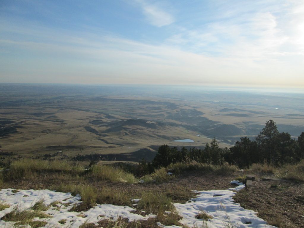 Sun-carpeted early-morning view of Eastern Wyoming from the Bighorn Mountains